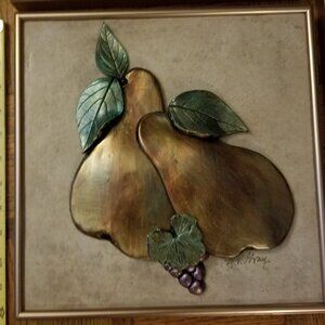 framed metallic fruit art on tile
